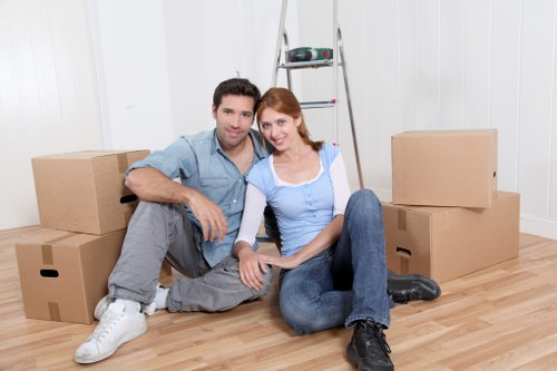 Movers assisting with a flat move in the Somers Town area