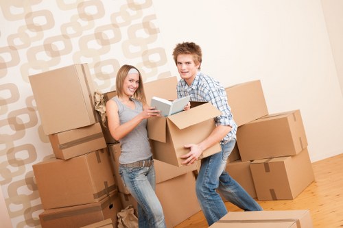 Unpacking boxes in a Somers Town home after a move