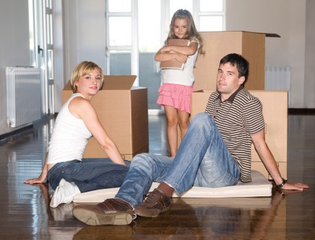 Furniture being carried from a Somers Town apartment